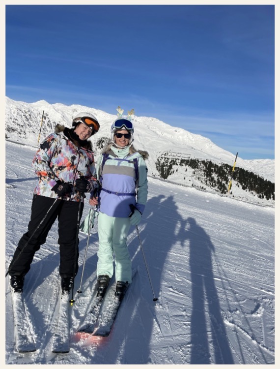 Two friends on the ski slopes